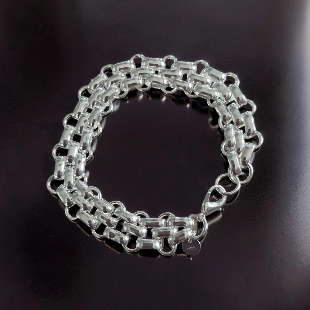 Gorgeous silver three row link bracelet! Measures 7.5 excellent unused condition